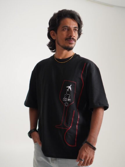 Black oversized tee with wine glass graphic and travel