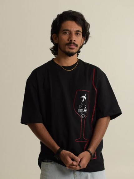 Black oversized tee with wine glass graphic and travel
