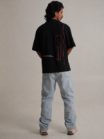 Black oversized tee with wine glass graphic and travel