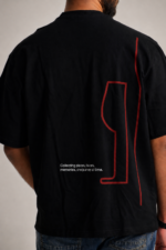 Black oversized tee with wine glass graphic and travel